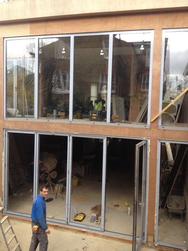 Aluminium bi-fold doors with two-storey glazing in Leyton