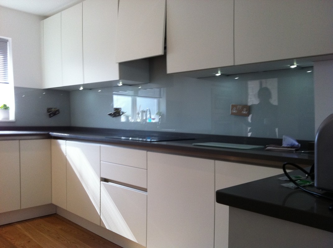 Grey glass kitchen splashback with LED lighting in Leyton
