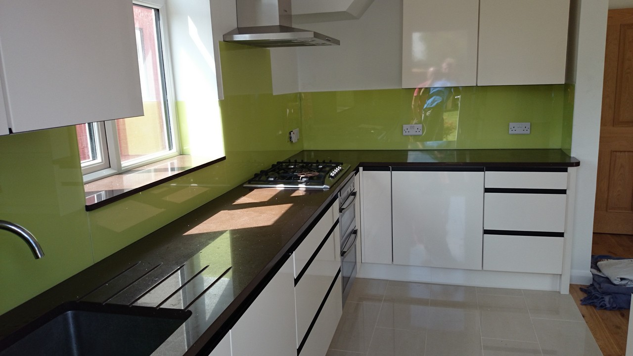 Lime green glass kitchen splashback installed by Leyton glaziers