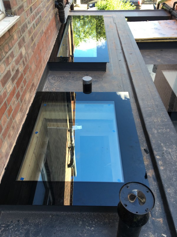 Multiple flat roof skylights on extension in Leyton